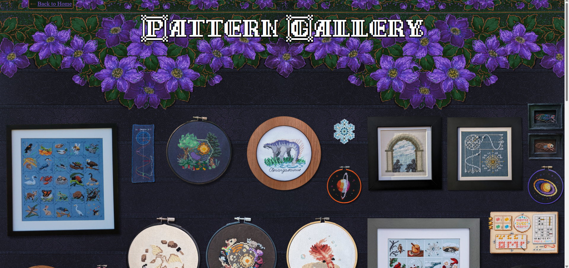 Pattern gallery screenshot; black textured wallpaper, purple flowers at the top of the screen, and the cross-stitches look as though they're hanging on the 'wall' of the page. 